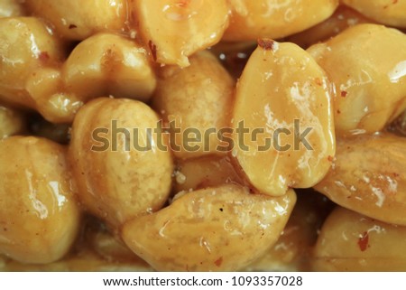 Picture of a candy. Peanuts in sugar glaze.