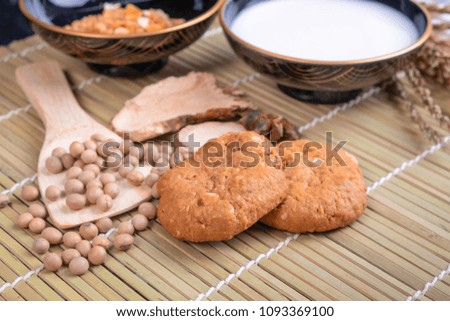 food concept styles - breakfast cookie Croissant grains and milk on the bamboo sheet food background
