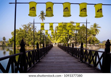 Wood bridge to Traphang Thong Temple, Sukhothai historical park, Thailand, Unesco world heritage.