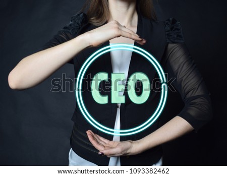 In the hands of a businessman, a neon circle with the inscription:CEO