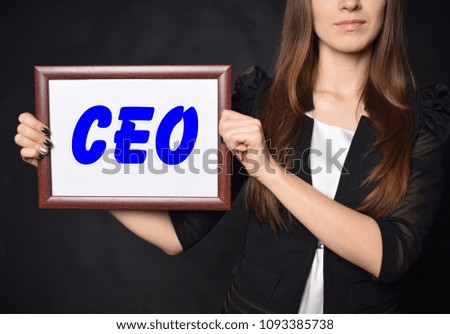 In the hands of a businessman a frame with the inscription:CEO