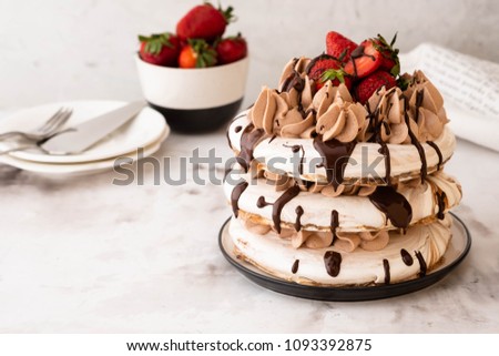 Pavlova cake with strawberry, chocolate.Festive atmosphere.Copy space.