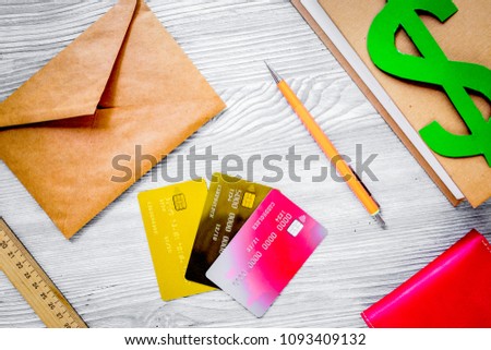 fee-paying education set with dollar sign, books and cards on li