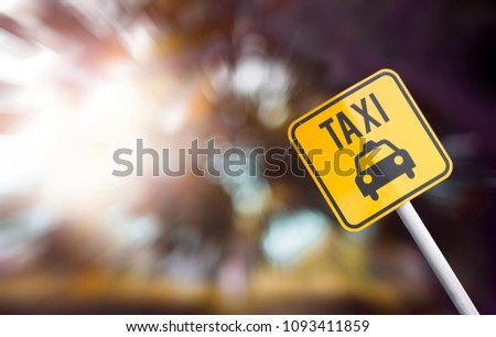 Signs taxi on bokeh background.