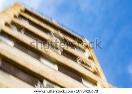 Abstract motion blur effect. City on a sunny day