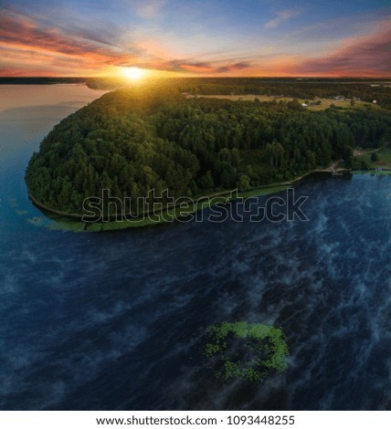 Rumsiskes, Lithuania. Bird's-eye view of a scenic sunset over the forest and Kaunas Reservoir.