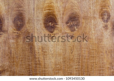 Brown wood wall with wood round years, abstract background pattern