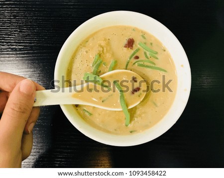 Penang famous desserts called cendol / Cendol is an iced sweet dessert that contains droplets of worm-like green rice flour jelly, coconut milk and palm sugar syrup