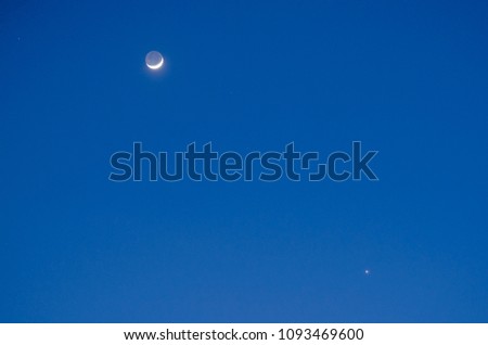 Moon First Quarter Third Quarter and Venus with blue sky.