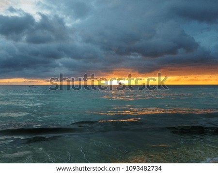 Sunset in the sea and cloudy orange sky at Boracay Island, Philippines. Defocus picture.