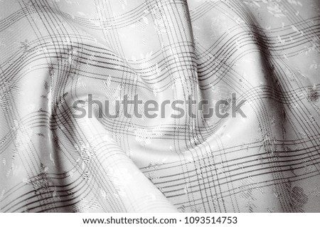 Texture background pattern. Silk fabric is brown, chocolate with milky color, carnelian, burnt sienna, flame, lust, persimmon, color. Abstract luxury fabric background or liquid waves or wavy 