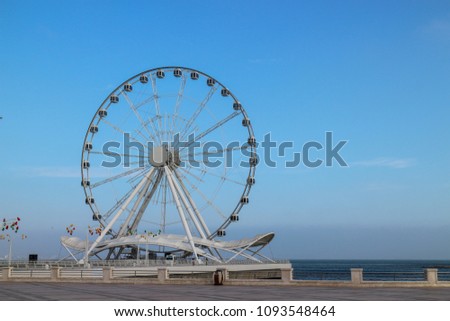 Ferris wheel in front of sky. Baku seaside boulevard. Big carousel