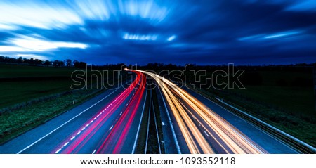 Light trails of a UK motorway Royalty-Free Stock Photo #1093552118