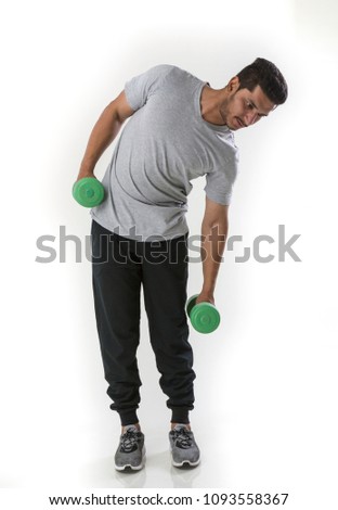 handsome young man exercising with green dumbbell  