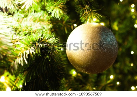 Close-up of glittering gold ball for Christmas tree decorations.