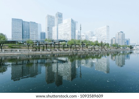 The SOHO in Beijing, China, is reflected in the water