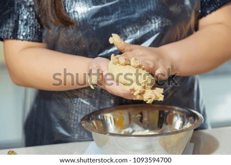 Mixing of ingredients for bread. Cooking bread. Fresh dough in hands