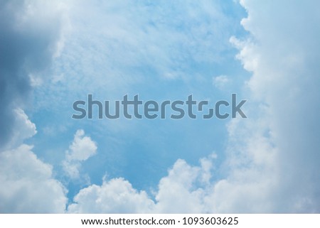 Gray and white cloud on blue sky  background with space in center