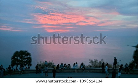 People Looking at the Beautiful Sky and the Picture
