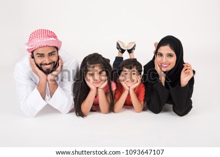 Arab Family lying down on the floor on white background