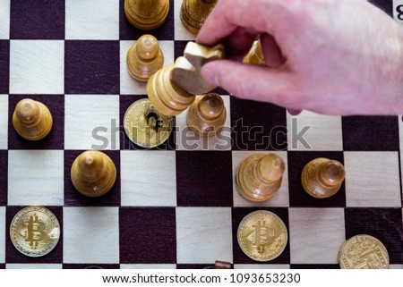 Golden bitcoin coins symbolizes elements of crypto currency with chess board