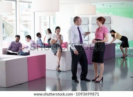 Image of Work colleagues in busy workplace