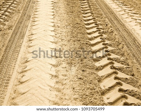 Tire tracks on the sand background