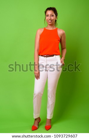 Studio shot of beautiful businesswoman against chroma key with green background