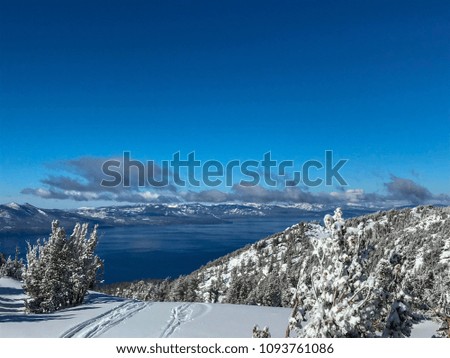 Heavenly Ski Resort in Tahoe, border of California and Nevada. Snowy mountains and Lake Tahoe, trees covered with snow.