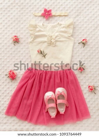 Concept of children's clothing, fashionable children's clothes, fashion. Skirt with flower headband, shoes for girl. 