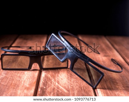 close up two 3d glasses on the wooden table 