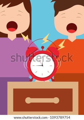 little boy and girl with alarm clock on bedside table