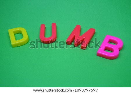 letters dumb on green background