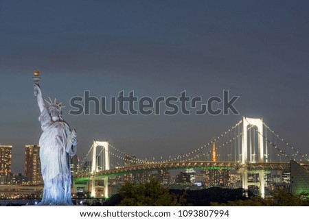 Odaiba Statue of Liberty & Rainbow Bridge, Tokyo, Japan.