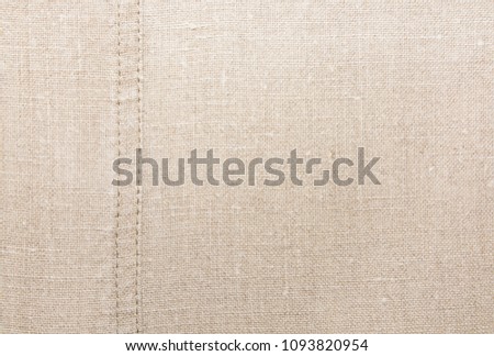 Texture of natural linen fabric with seam
