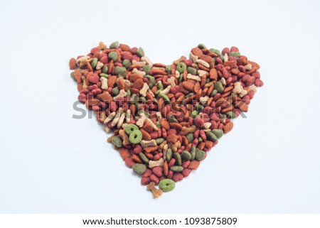 dog food on the white background, isolate feed dog in the heart picture 