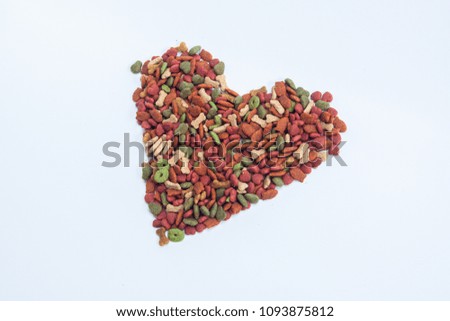 dog food on the white background, isolate feed dog in the heart picture 