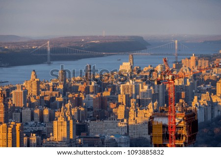 Amazing New York city skyline and skyscraper at sunset with Hudson river and bridge background