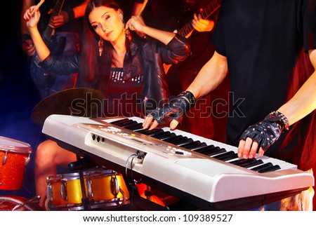 Musical group performance in night club.