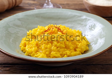 italian risotto with saffron Royalty-Free Stock Photo #1093904189