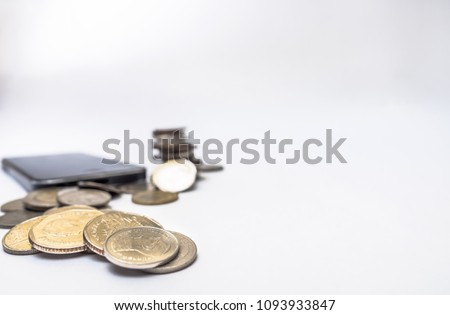 Coin thai bath stacking up with smartphone on white background