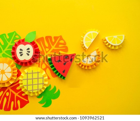 Fruit made of paper. Yellow background. There's room for writing.Tropics. Flat lay.