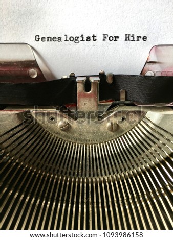 Genealogist For Hire heading typed on white paper in black ink on manual vintage typewriter