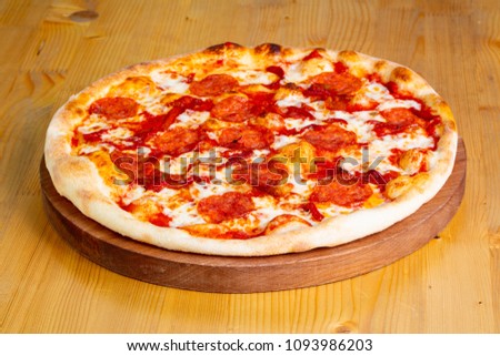Pepperoni Hot pizza over wooden