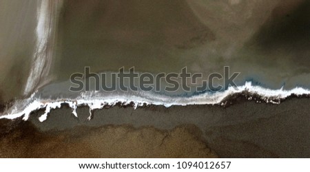 black beach, black gold, polluted desert sand, abstract photo of the deserts of Africa from the air. aerial view, Genre: Abstract Naturalism, from the abstract to the figurative