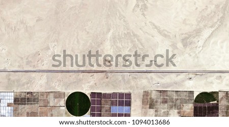 The power of the wind, farms of human crops in the desert, abstract photography of the deserts of Africa from the air, Genre: Abstract Naturalism, from the abstract to the figurative, 