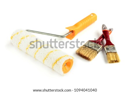 Paint brush and roller isolated on white background.