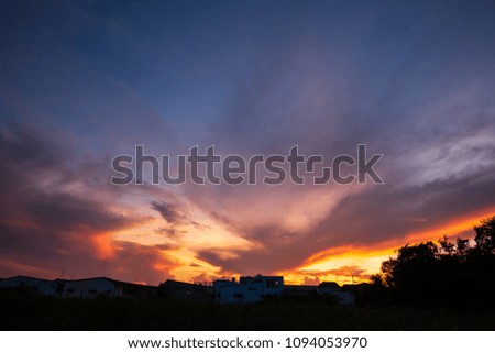 Natural Sunset Sunrise Over city home. Orange Landscape Under Scenic Colorful Sky At Sunset