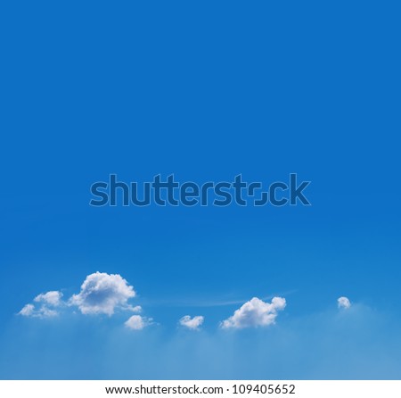 Blue sky with clouds background Royalty-Free Stock Photo #109405652