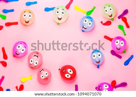 happy faces on colorful ballons for birthday on pink background , holiday concept